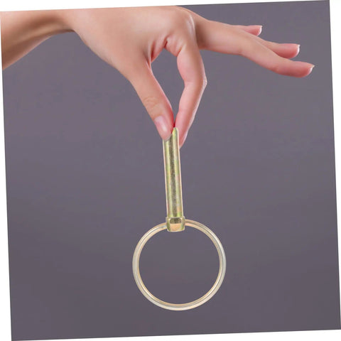 Heavy Duty Lynch Pin Kit 8 Pack For Farm Tractors Mowers And Trucks Tough As Nails Durable Safety Pins With Rings For Secure Hitching And Easy Towing Ideal For All Weather Farm Equipment Attachments And Reliable Quick Hitching Solutions. Golden iron lynch pin with ring held by hand