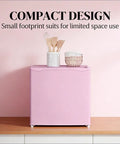 Slick Compact Upright Freezer Featuring Adjustable Temperature Settings Removable Shelf Reversible Door For Tight Kitchens Hella Tough Steel Frame With Fun Ice Cube Making Gear For Busy Households on wood surface with kitchen utensils.