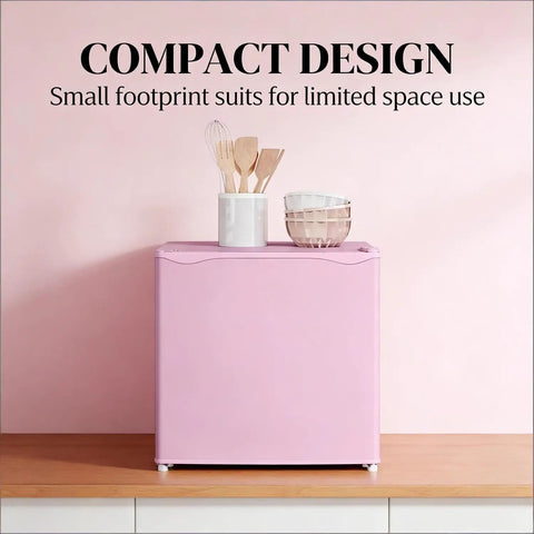 Slick Compact Upright Freezer Featuring Adjustable Temperature Settings Removable Shelf Reversible Door For Tight Kitchens Hella Tough Steel Frame With Fun Ice Cube Making Gear For Busy Households on wood surface with kitchen utensils.