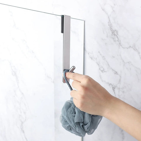 Hand hanging loofah on Extended Seven Inch Over Door Hooks For Frameless Glass Shower Doors, Towel Hangers, 2-Pack, Silver Finish.