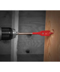 Diablo by Freud SPEEDemon red spade bit installed in drill, side view, drilling into wood