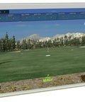 Electric Retractable Golf Simulator Impact Screen Kit With Pad Pro 94 By 126 Inches in use, displaying a digital golf course.