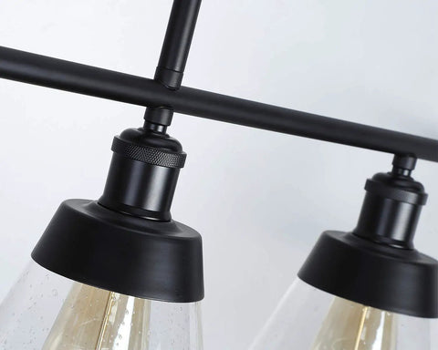 Close-up of Dope 3 Light Farmhouse Black Kitchen Island Pendant Light With Clear Seeded Glass And Adjustable Rods showing detail.