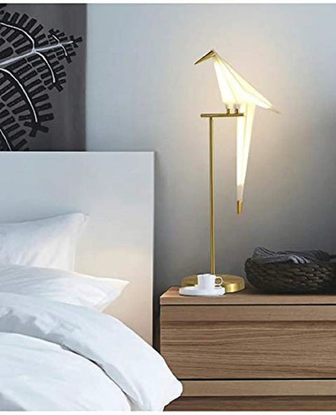Bird Themed Modern Art LED Floor Lamp For Home and Office, tall standing light with PVC shade by a bedside table in bedroom.