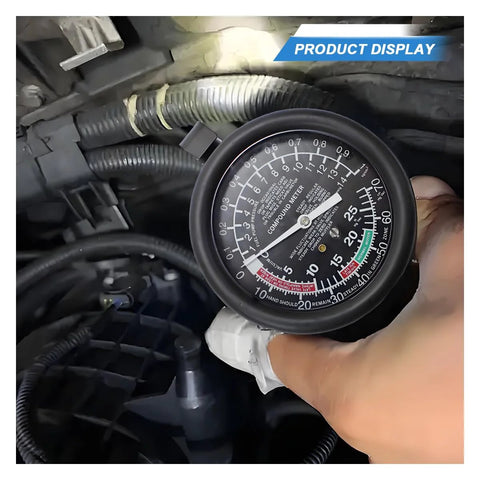 Fuel pump and vacuum tester gauge held in hand inside car engine bay; large black dial with white markings