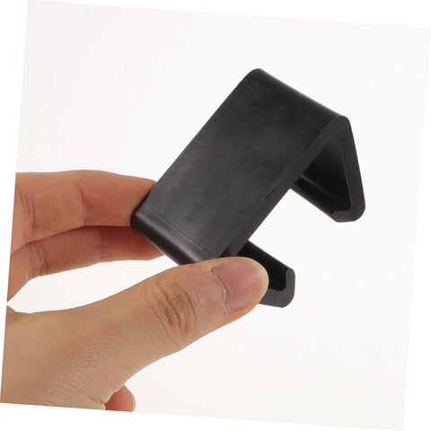 Close-up of a black clip from Outdoor Sofa Clips 12 Pack For Sectional Couches And Rattan Furniture, Windproof Connection Fasteners.