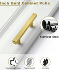 3 Inch gold cabinet pull on white panel, brushed brass finish, hollow stainless steel, anti-rust, 30 Pack Brushed Brass Cabinet Handles 3 Inch Modern Square Drawer Pulls For Cabinets And Drawers With 5 Inch Total Length Durable Hollow Stainless Steel Hardware Gold Finish For Kitchen Cabinets And Dressers