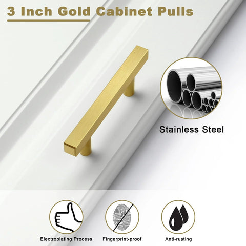 3 Inch gold cabinet pull on white panel, brushed brass finish, hollow stainless steel, anti-rust, 30 Pack Brushed Brass Cabinet Handles 3 Inch Modern Square Drawer Pulls For Cabinets And Drawers With 5 Inch Total Length Durable Hollow Stainless Steel Hardware Gold Finish For Kitchen Cabinets And Dressers