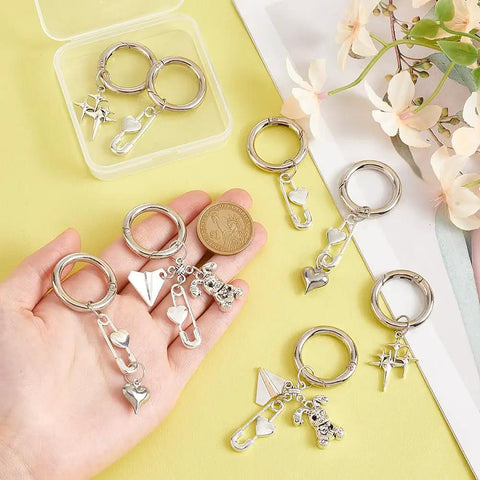Fresh Safety Pin Shoe Charms With Sturdy Spring Clips And Alloy Badges Featuring Star Heart Rabbit Designs For Boots Bags And Purse Gear That Bring Serious Vintage Vibes And Always Deliver The Goods, displayed on a hand.
