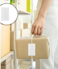 White PVC Tags With Lanyards 100-Count Bulk Waterproof Blank Labels attached to a package for labeling and organization.