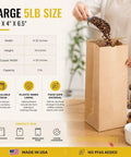 Person filling Pack Of 250 Brown Paper Tin Tie Coffee Bags With Reclosable Seal Stand Up Pouches For Coffee Cookies Bakery Packaging And Food Storage Sixteen Inch By Six And One Half Inch By Four Inch with coffee beans
