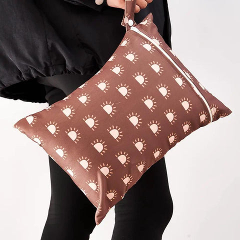 Brown bag with sun pattern from Three Piece Waterproof Wet Bag Storage Set For Baby And Travel Reusable Diaper Bag Swim Bag