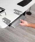 Universal Under Desk Laptop Mount With Adjustable Tablet Brackets For Hidden Computer Docking Station, holding a laptop.