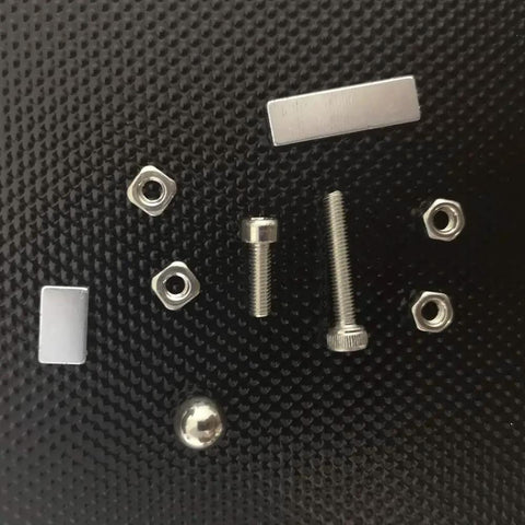 Filament IR Sensor Upgrade Kit For Prusa I3 MK2.5 MK3 Series components, including steel ball, magnets, screws, and nuts on black surface.