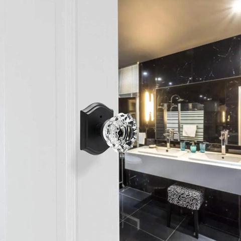 Matte Black Glass Door Knobs With Lock For Interior Doors, Privacy Crystal Knob Set installed on a bathroom door, vintage style.
