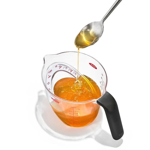 Angled 2 Cup Measuring Cup With Easy Read From Above Measurements pouring liquid, BPA Free Tritan Renew, Soft Non Slip Handle