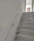 Heavy Duty Clear Acrylic Railing System For Decks Patios And Balconies Weather Resistant Panels mounted on a staircase.