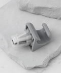 Two Piece Car Sun Visor Clip Hook Bracket Replacement 74348 06030 for Toyota on marble surface
