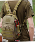 Person wearing Camouflage Oxford Cloth Outdoor Fishing Backpack With Large Capacity Tactical Hiking Daypack For Men Women And Boys Tough Camping Gear Organizer For Trekking Travel And Everyday Adventures