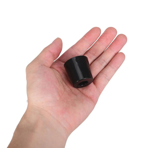 Set Of 10 Black Rubber Door Stops With Stable Wall Mount And Anti Slip Pads held in hand