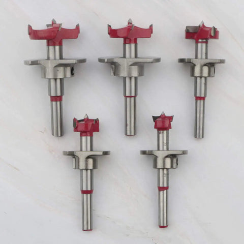 Pro Level 5 Piece Forstner Drill Bit Set Covering 15 To 35mm with red tips, showcasing precision for clean hole boring.