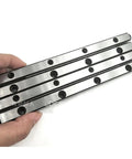 Hand holding four stacked Beefed Up Cross Roller Linear Guide VR4160 VR4 160x15Z GCr15 With 106mm Max Stroke For Precision CNC And Automation