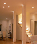 Modern living room with 12 Pack Slim 6 Inch LED Recessed Downlights, Ultra Thin 0.39 Inch Canless Fixture, damp rated installed.