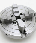 Close-up of Bad Boy Heavy Duty Six Inch Four Jaw Self Centering Wood Lathe Chuck Crafted From Premium Steel with gripping jaws for woodturning.