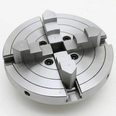 Close-up of Bad Boy Heavy Duty Six Inch Four Jaw Self Centering Wood Lathe Chuck Crafted From Premium Steel with gripping jaws for woodturning.