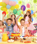 Children at a birthday party with balloons, cake, and Logo Ready Printed Kraft Paper Bags 100 Pack With Handles 12.6 X 4.3 X 9.8 Inches