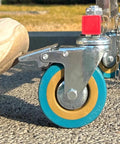 Close-up of hella smooth moving universal casters on Heavy Duty Adjustable Stainless Steel Retractable Safety Gate.