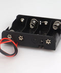 No Sweat 2 Pack 4 Slot AA Battery Holder With Tipped Leads, black plastic, four slots for AA batteries, wiring for electronics.