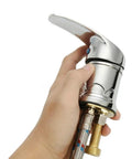 Hand holding Heavy Duty Zinc Alloy Shampoo Bowl Faucet Set Featuring Dual Hot And Cold Water Mixer With Flexible Spray Hose.
