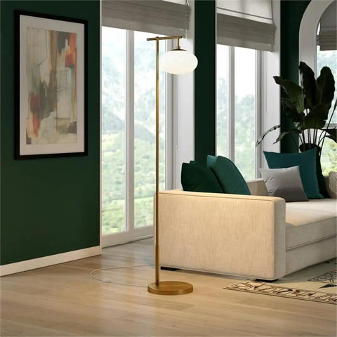 Go To 68 Inch Tall Arc Floor Lamp With Glass Shade In Brushed Brass And Milk White in a modern living room setting.