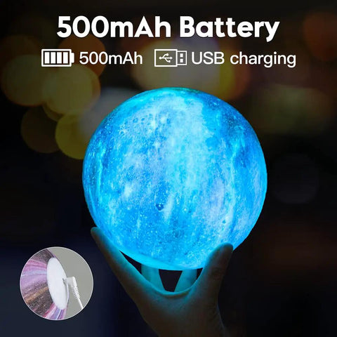 Hand holding illuminated Moon Galaxy Lamp 5.9 Inch with 16 Color LED 3D Moon Light, highlighting blue glow and USB charging