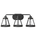Wicker Park 3-Light Vanity Light Fixture In Weathered Pewter With Old Satin Brass Accents, front view showing three bulbs