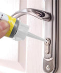 Applying 60ml Graphite Lock Lubricant Two Pack For Door Locks Keys Windows And Cars to a door latch for smooth operation.