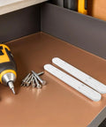 Two white ABS drawer slides next to screws and a screwdriver, part of 8 Pack White ABS Cabinet Drawer Slides With No Fuss Tool Free Installation