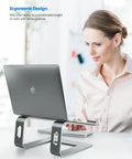 Woman using an all-aluminum laptop stand for desk setup with ventilated cooling, holding a notebook for 10-16 inch laptops.