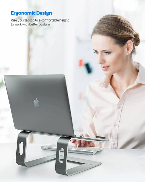 Woman using an all-aluminum laptop stand for desk setup with ventilated cooling, holding a notebook for 10-16 inch laptops.