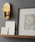 Two Pack Brushed Gold Oval Wall Sconces Modern Mid Century Vanity Lights For Bathroom Mirror And Living Room Hallway Dope Minimalist Design With Concealed Lamp Base And Thick Solid Back Plate beside framed art