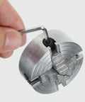 Mini 4-Jaw Lathe Chuck Manual Clamp Hand Chuck For Precision Machining And DIY Metalworking, zinc alloy jaws being adjusted