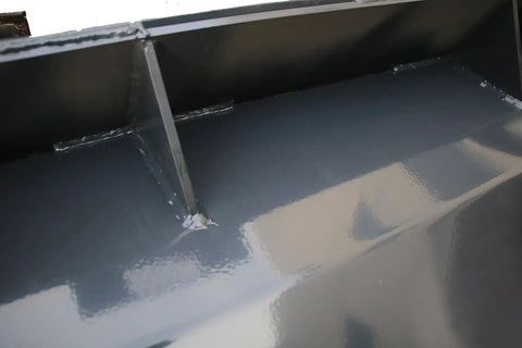 Close-up of metal frame of Beefy 72 Inch Rotary Tiller For Skid Steer Hydraulic Attachments Cultivator For Garden And Lawn Heavy Duty
