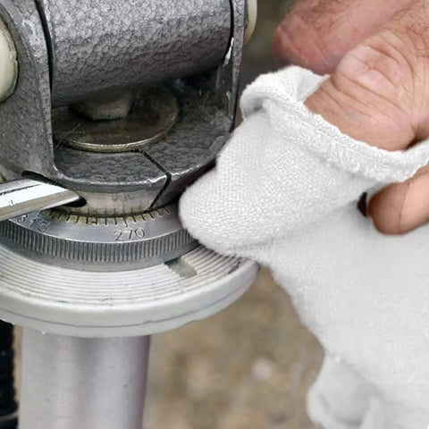 Close-up of hand using Pack Of 150 Cotton Shop Towels 12 By 14 Inches Absorbent Multipurpose Cleaning Rags for auto shop metal part
