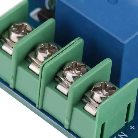 Close-up of No Sweat Battery Charge Control Module terminals showing green connectors for six to sixty volt charging.