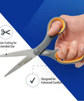 Hand holding 8 Inch Titanium Bonded Straight Scissors With Soft Grip Handle Gray And Yellow 4 Pack For Precision Cutting