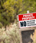 Tough As Nails Private Property No Trespassing Signs on wooden post, 10x14 inches, heavy duty aluminum, outdoor security.