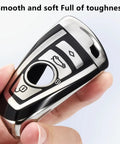 BMW Key Fob Cover With Soft TPU Case Advanced Silver Key Box for X1 X3 X5 X6, shown close-up in hand.