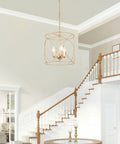Gold Pendant Light With Cylindrical Lattice Cage Frame And Spherical Center Three Gold Candelabra Arms Bold Modern Farmhouse Vibe For Kitchen Island And Dining Room 13 Inch By 13 Inch By 14 Inch hanging in a bright entryway.