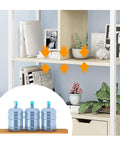 Totally Solid 5 Tier Industrial Bookcase In Premium Walnut Finish displaying books and plants on open shelves.
